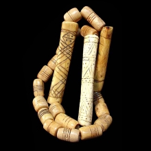 a-necklace-of-coptic-bone-beads-bearing-incised-designs_a7044c