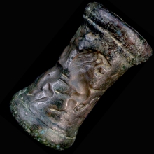 a-very-large-iranian-bronze-cylinder-seal,-the-imprint-depicting-two-handlers-controlling-a-lion-and-zebu-bull_x7084a