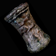 a-very-large-iranian-bronze-cylinder-seal,-the-imprint-depicting-two-handlers-controlling-a-lion-and-zebu-bull_x7084b