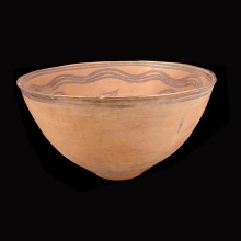 an-indo-iranian-pottery-bowl-with-caprid-and-skirl-motif-in-brown-pigment_x2871b