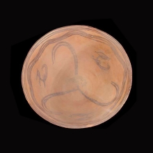 an-indo-iranian-pottery-bowl-with-caprid-and-skirl-motif-in-brown-pigment_x2871c