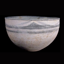 an-indo-iranian-pottery-vessel-with-geometric-painted-motif-in-black-pigment-around-rim-and-incised-linear-motif-on-body_x1040b