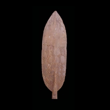 an-old-mimika-canoe-paddle,-the-blade-with-carved-abstract-designs-on-one-surface_t2473b